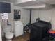 Basement bathroom with toilet, sink, and washer at 645 S Perry St, Denver, CO 80219