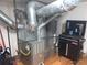 Basement mechanical room with furnace and pipes at 645 S Perry St, Denver, CO 80219