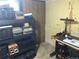 Unfinished basement workshop with tools and shelves at 645 S Perry St, Denver, CO 80219