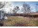 Large backyard offers plenty of room for recreation, enclosed by a well-maintained wooden fence at 6903 W 52Nd Pl, Arvada, CO 80002
