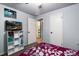 Bright bedroom featuring light walls, and a door leading to the bathroom, creating a calming living space at 6903 W 52Nd Pl, Arvada, CO 80002