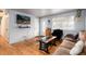 Inviting living room featuring hardwood floors, neutral walls, and a comfortable seating area for relaxing at 6903 W 52Nd Pl, Arvada, CO 80002