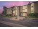 Exterior view of the condo building with well-maintained landscaping and an accessible entrance at 2231 S Vaughn Way # 114B, Aurora, CO 80014