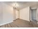 Bright, open room with wood floors, closet and view of the entry door at 2231 S Vaughn Way # 114B, Aurora, CO 80014