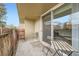 Outdoor patio features a seating area with a table, chairs, and sliding glass door access to the living space at 2231 S Vaughn Way # 114B, Aurora, CO 80014