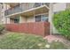 Enclosed outdoor patio space with privacy fence and small patch of lawn for ground level unit at 2231 S Vaughn Way # 114B, Aurora, CO 80014
