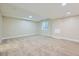 Well-lit basement featuring neutral paint, carpeting, and recessed lighting for versatile living at 6596 Silverleaf Ave, Firestone, CO 80504