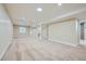 Finished basement with plush carpet, recessed lighting, and ample room for recreation at 6596 Silverleaf Ave, Firestone, CO 80504