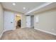 A finished basement area featuring doorway access to a laundry room with washer and dryer at 6596 Silverleaf Ave, Firestone, CO 80504