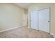 Neutral bedroom with carpet floors, sliding door closet, and ample space for furniture at 6596 Silverleaf Ave, Firestone, CO 80504