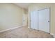 Comfortable carpeted bedroom with closet and bright paint at 6596 Silverleaf Ave, Firestone, CO 80504