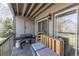 Relaxing balcony with grill and seating, perfect for enjoying the outdoors at 2575 S Syracuse Way # M206, Denver, CO 80231