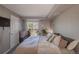 Inviting bedroom with a sliding glass door to a private balcony and ensuite bath at 2575 S Syracuse Way # M206, Denver, CO 80231