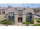 Charming multi-story condo building with stone accents, balconies, and well-kept landscaping at 2575 S Syracuse Way # M206, Denver, CO 80231