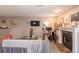 Living room with a fireplace, TV, and home office area with natural light at 2575 S Syracuse Way # M206, Denver, CO 80231