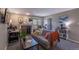 Cozy living room with a fireplace, neutral tones, and sliding door to a balcony at 2575 S Syracuse Way # M206, Denver, CO 80231