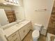 Bright bathroom featuring a vanity with a white countertop and a large, frameless mirror at 1125 S Oneida St # F, Denver, CO 80224