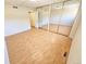 This is a spacious bedroom featuring wood floors and a large mirrored closet at 1125 S Oneida St # F, Denver, CO 80224