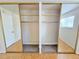 This is a large closet with mirrored doors, shelving, and carpeted floor at 1125 S Oneida St # F, Denver, CO 80224