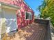 Exterior shot of a home with a wooden deck and a white front door at 1125 S Oneida St # F, Denver, CO 80224