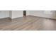Spacious living room featuring luxury vinyl plank flooring and neutral paint at 1639 Pinnacle Ave, Lochbuie, CO 80603