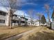 Condo building showcasing a walkway and surrounding grounds at 14453 E Jewell Ave # 104, Aurora, CO 80012