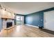 Bright living room featuring a stone fireplace and sliding doors to the balcony at 14453 E Jewell Ave # 104, Aurora, CO 80012