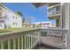 Cozy outdoor patio overlooking lush green lawn in a charming residential community on a bright sunny day at 14453 E Jewell Ave # 104, Aurora, CO 80012