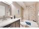 Bathroom with tub shower, vanity, and mirror at 13500 E Cornell Ave # 309, Aurora, CO 80014