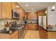 Open concept kitchen with stainless steel appliances at 1950 N Logan St # 102, Denver, CO 80203