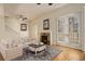 Bright living room with fireplace and French doors leading to balcony at 1950 N Logan St # 102, Denver, CO 80203