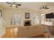 Living room with hardwood floors, fireplace, and French doors at 1950 N Logan St # 102, Denver, CO 80203