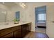 Modern bathroom with double vanity and view of bedroom at 9283 Twenty Mile Rd # 403, Parker, CO 80134