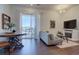 Living room with sliding glass door to balcony and hardwood floors at 9283 Twenty Mile Rd # 403, Parker, CO 80134