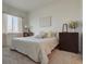 Spacious main bedroom with large bed, dresser, and natural light at 9283 Twenty Mile Rd # 403, Parker, CO 80134