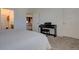 Main bedroom with piano, access to bathroom and kitchen at 9283 Twenty Mile Rd # 403, Parker, CO 80134