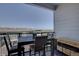 Private balcony with table and chairs, overlooking a community view at 9283 Twenty Mile Rd # 403, Parker, CO 80134