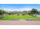 Lush backyard featuring a well-maintained lawn, mature landscaping, and a wooden deck area for outdoor enjoyment at 11366 Haswell Dr, Parker, CO 80134