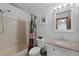 Clean bathroom featuring a shower-tub combo, white vanity with granite countertop, and updated fixtures at 11366 Haswell Dr, Parker, CO 80134