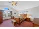 Bedroom boasts vaulted ceiling, large arched window, and wood furniture at 11366 Haswell Dr, Parker, CO 80134