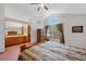 Bedroom features vaulted ceiling, large arched window, and ensuite bathroom at 11366 Haswell Dr, Parker, CO 80134