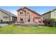Back exterior of home showcasing a spacious deck, well-manicured lawn, and inviting outdoor space at 11366 Haswell Dr, Parker, CO 80134