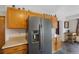 Kitchen includes stainless steel refrigerator and oak cabinetry at 11366 Haswell Dr, Parker, CO 80134