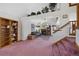 Bright living room with high ceiling, fireplace, television, cozy sofa and plush carpet at 11366 Haswell Dr, Parker, CO 80134
