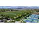 Aerial view of the community showing the large open field, tennis courts, mountain views and walking path at 9522 Castle Ridge Cir, Highlands Ranch, CO 80129
