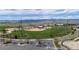 Aerial view of a meticulously kept baseball field in a park setting with mountain views and ample parking at 9522 Castle Ridge Cir, Highlands Ranch, CO 80129