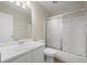 Bathroom featuring tile flooring, a glass shower, and a single sink vanity at 9522 Castle Ridge Cir, Highlands Ranch, CO 80129