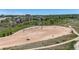 Large, fenced dog park area with shade structures and pathways, ideal for recreation and community interaction at 9522 Castle Ridge Cir, Highlands Ranch, CO 80129