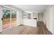 Open floor plan with wood floors, a fireplace, and a sliding door to the deck at 9522 Castle Ridge Cir, Highlands Ranch, CO 80129