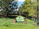 Redstone Park sign with lush green grass and trees in a well-maintained Highlands Ranch Metro District neighborhood at 9522 Castle Ridge Cir, Highlands Ranch, CO 80129